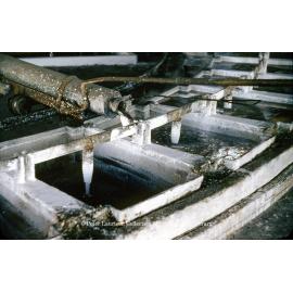 Pouring molten lead into casting wheel moulds at Lead Smelter, Mount Isa Mines, July 1956